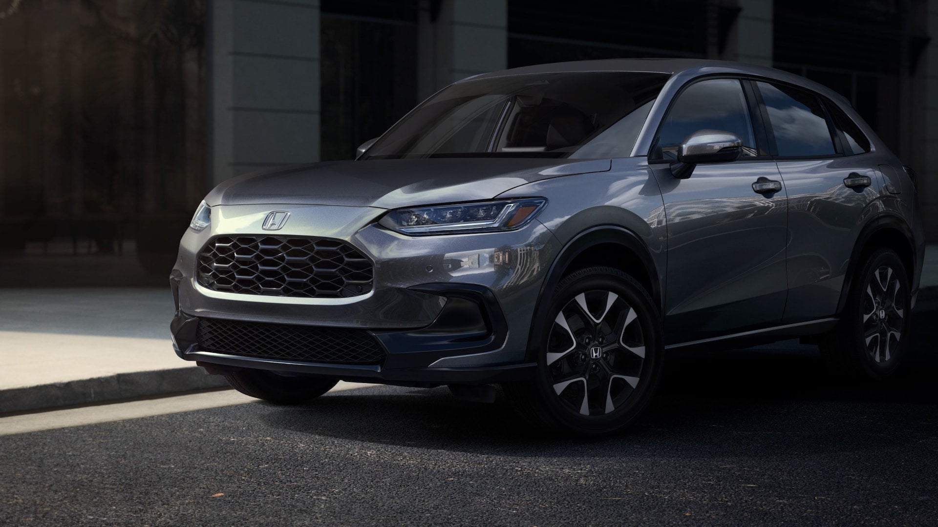A gray Honda HR-V parked by the curb