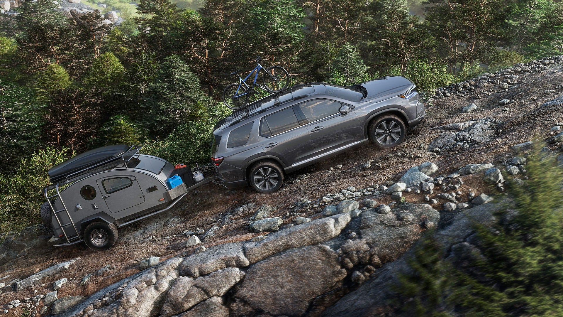 A gray Honda Pilot towing a small trailer up a rocky hill in a forest